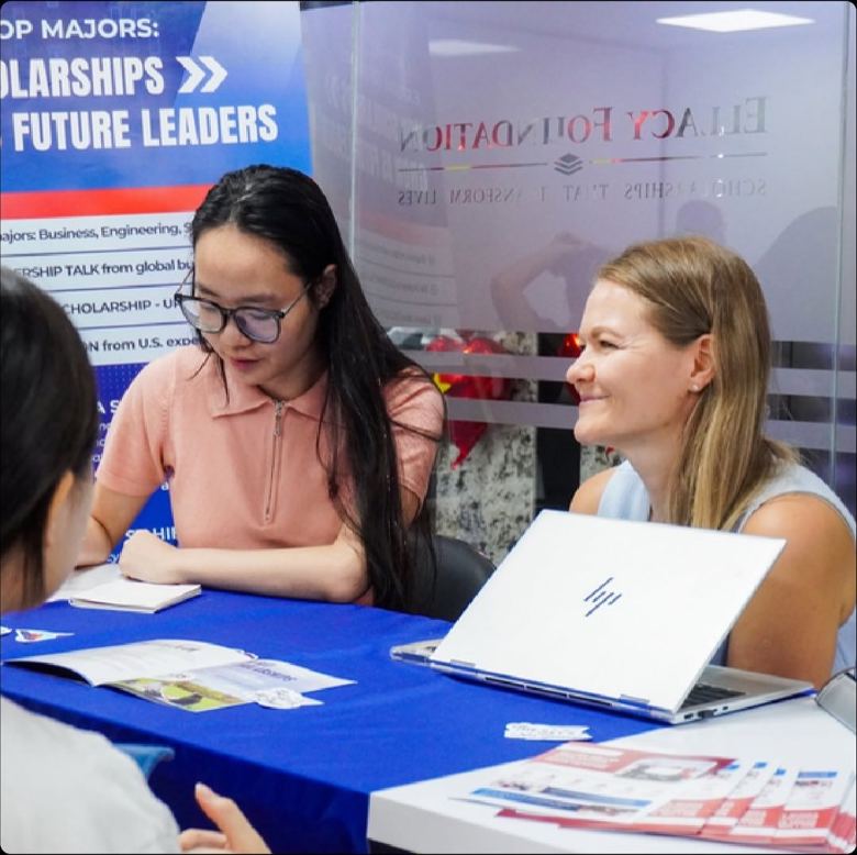 One-on-one application advice for students at an education fair